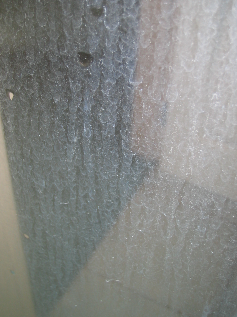 how to get hard water spots off shower glass